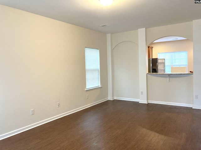 empty room featuring dark hardwood / wood-style floors