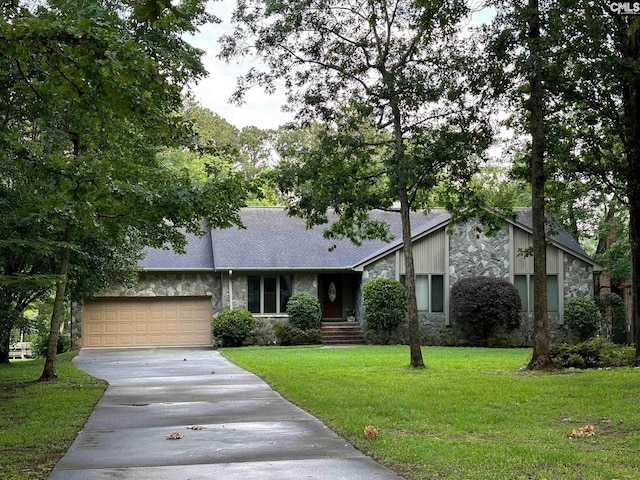 125 Milmont Shores Rd, Chapin, SC 29036 - mid-century modern home featuring stone siding, driveway, an attached garage, a front lawn, and a shingled roof