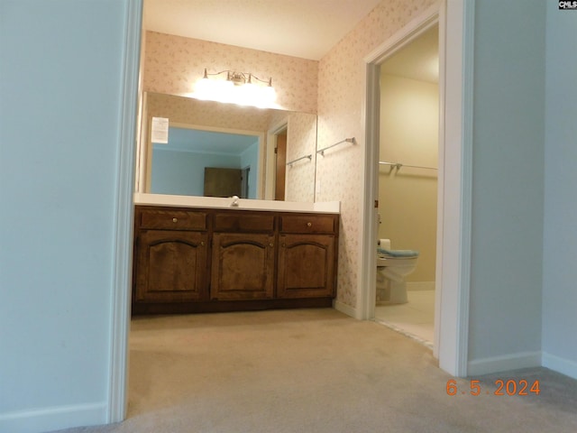 bathroom with vanity and toilet