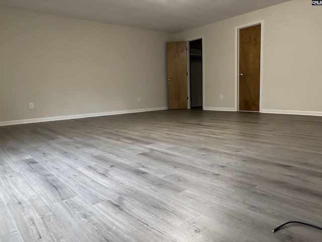 125 Milmont Shores Rd, Chapin, SC 29036 - unfurnished bedroom featuring dark wood-type flooring and baseboards