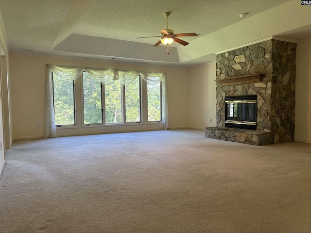 125 Milmont Shores Rd, Chapin, SC 29036 - unfurnished living room featuring plenty of natural light, a tray ceiling, ceiling fan, carpet, and a textured ceiling