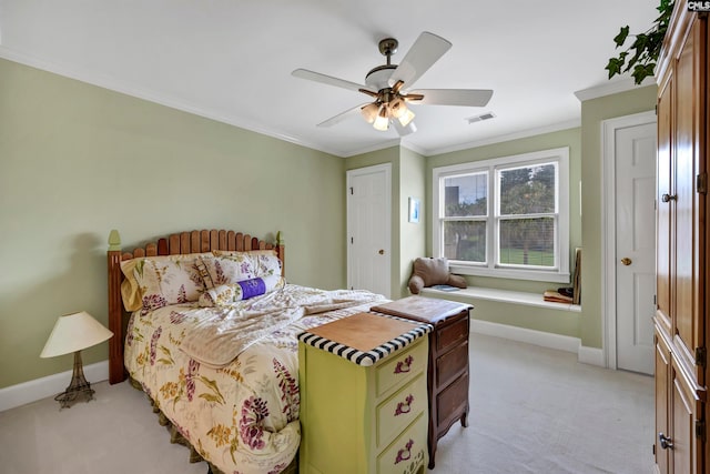 bedroom with ceiling fan, crown molding, and light colored carpet