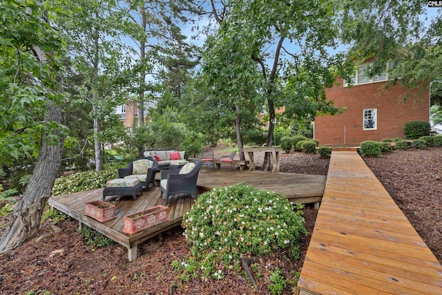 view of yard with an outdoor living space and a deck