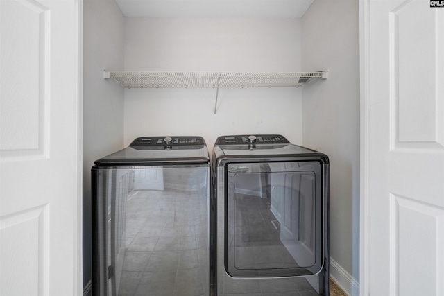 laundry room featuring washing machine and dryer