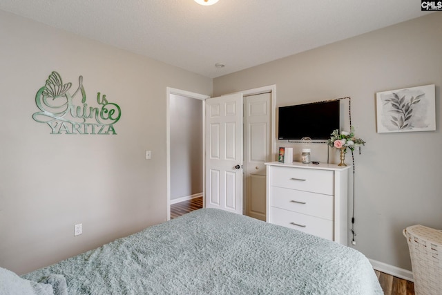 bedroom featuring dark hardwood / wood-style floors