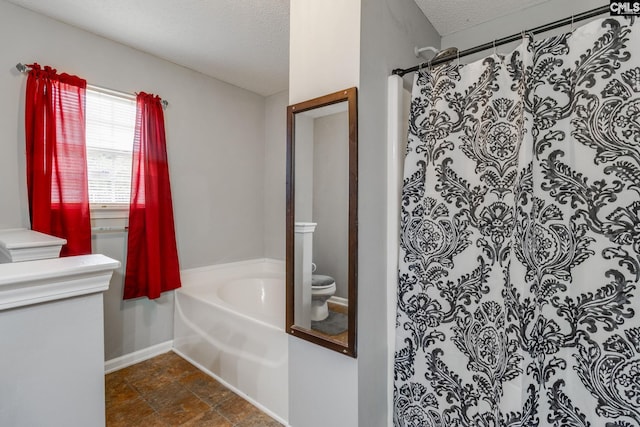 bathroom with shower with separate bathtub, a textured ceiling, and toilet