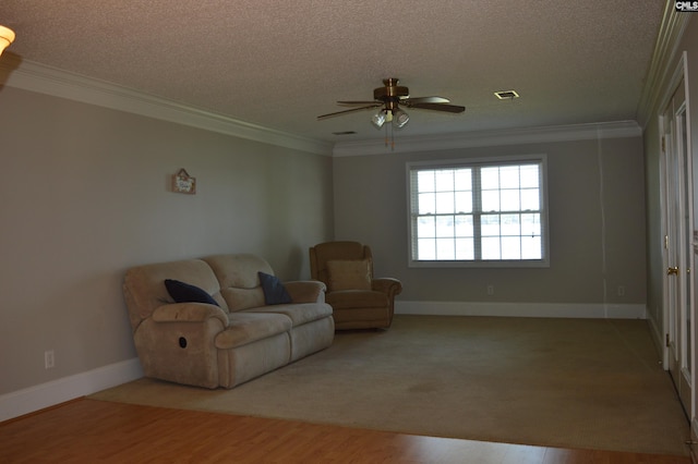 living room with ornamental molding, a textured ceiling, and light hardwood / wood-style flooring