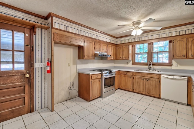 kitchen with stainless steel gas stove, crown molding, dishwasher, ceiling fan, and sink