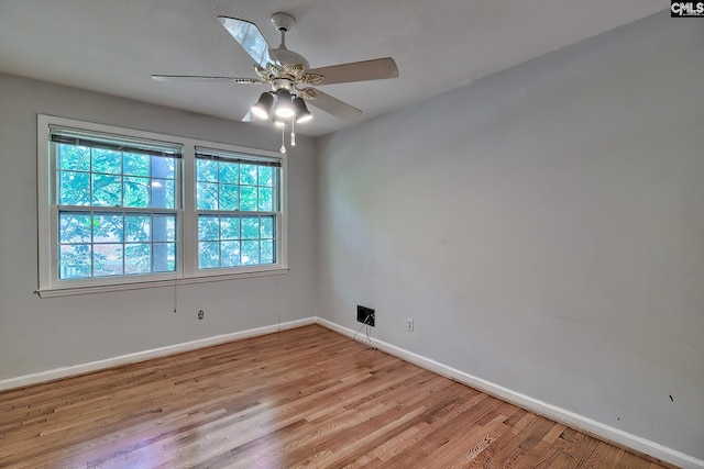 unfurnished room with light wood-type flooring and ceiling fan