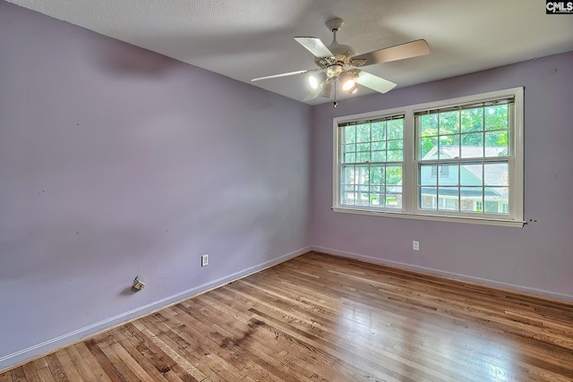 unfurnished room featuring ceiling fan and light hardwood / wood-style floors