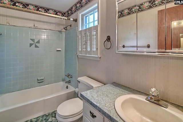 full bathroom featuring vanity, toilet, and tiled shower / bath