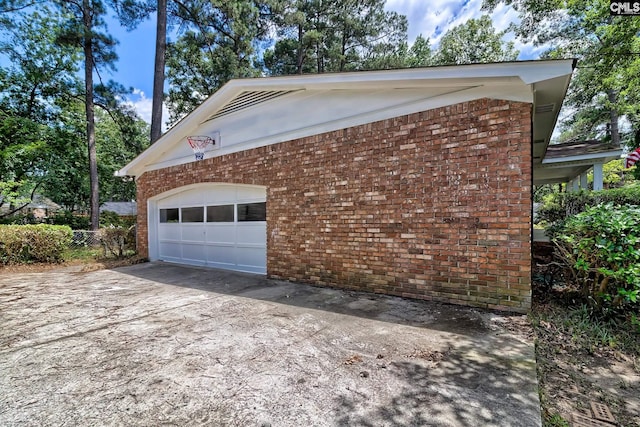 view of home's exterior with an outbuilding and a garage