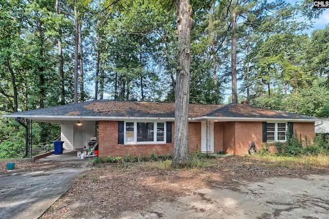 ranch-style house with a carport