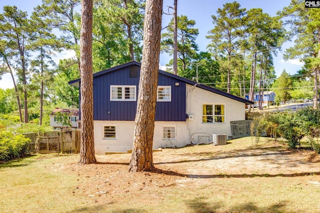 view of side of home featuring cooling unit