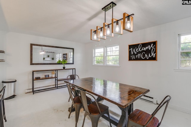 dining space with a baseboard heating unit