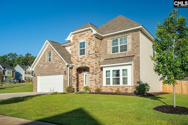 view of front of house featuring a garage and a front lawn