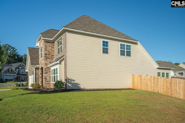 view of property exterior featuring a yard