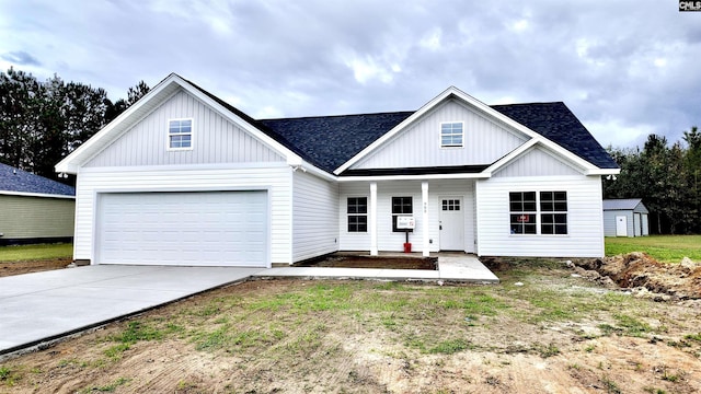 modern inspired farmhouse featuring concrete driveway and roof with shingles