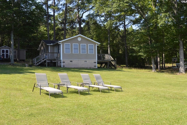 view of yard with a deck and a shed