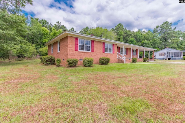 ranch-style home with a porch, brick siding, crawl space, and a front yard