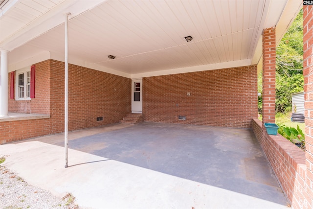 view of patio featuring entry steps and an attached carport