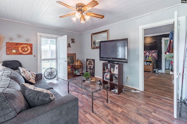 living room with ceiling fan and wood finished floors