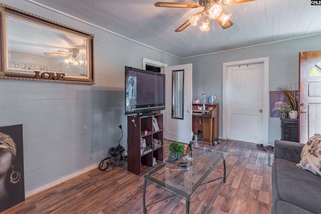 living area featuring wood finished floors and a ceiling fan