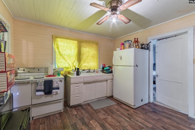 kitchen with white appliances, white cabinetry, dark wood-style flooring, and wood walls