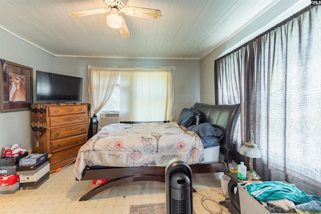 bedroom featuring a ceiling fan, cooling unit, wooden ceiling, and multiple windows