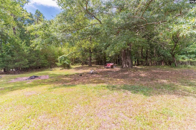 view of yard with a forest view