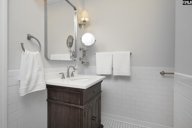 bathroom featuring tile patterned floors, vanity, and tile walls