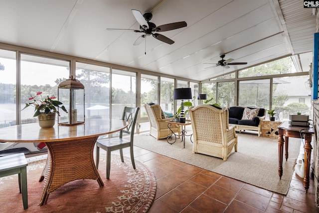 sunroom featuring ceiling fan and vaulted ceiling