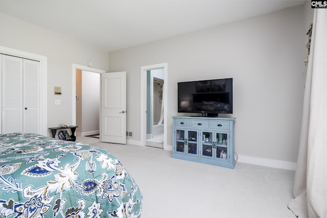 carpeted bedroom with a closet