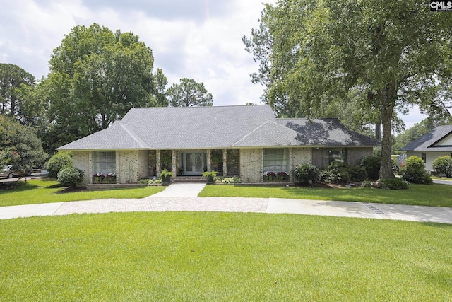 ranch-style house with a front lawn