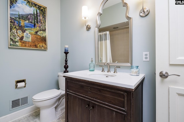 bathroom with vanity, toilet, and curtained shower