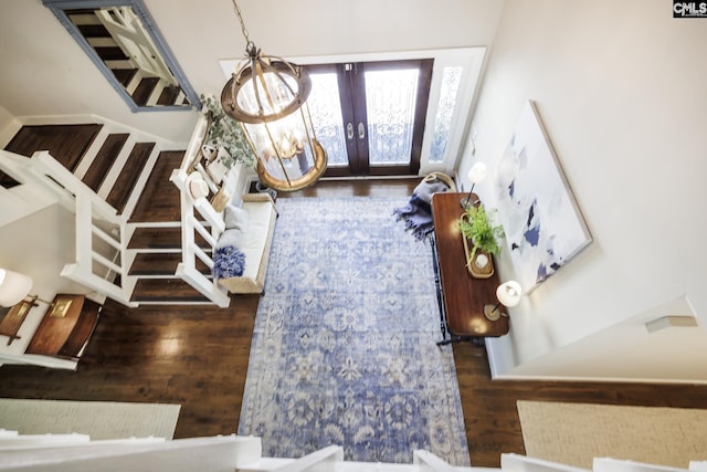 foyer entrance with french doors and wood-type flooring