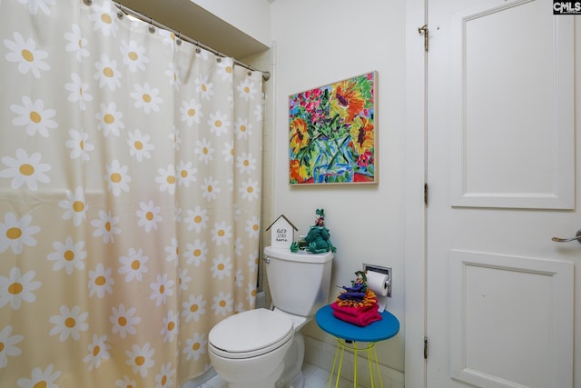 bathroom with tile patterned floors and toilet