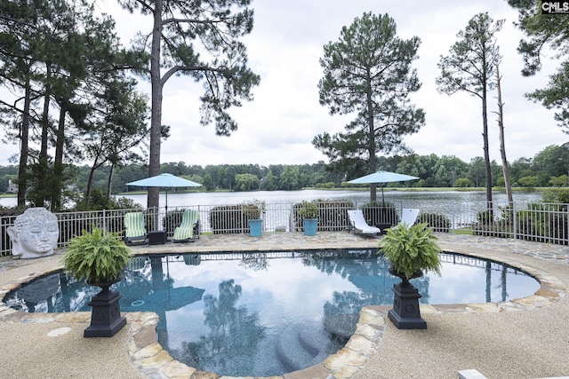 view of pool with a water view