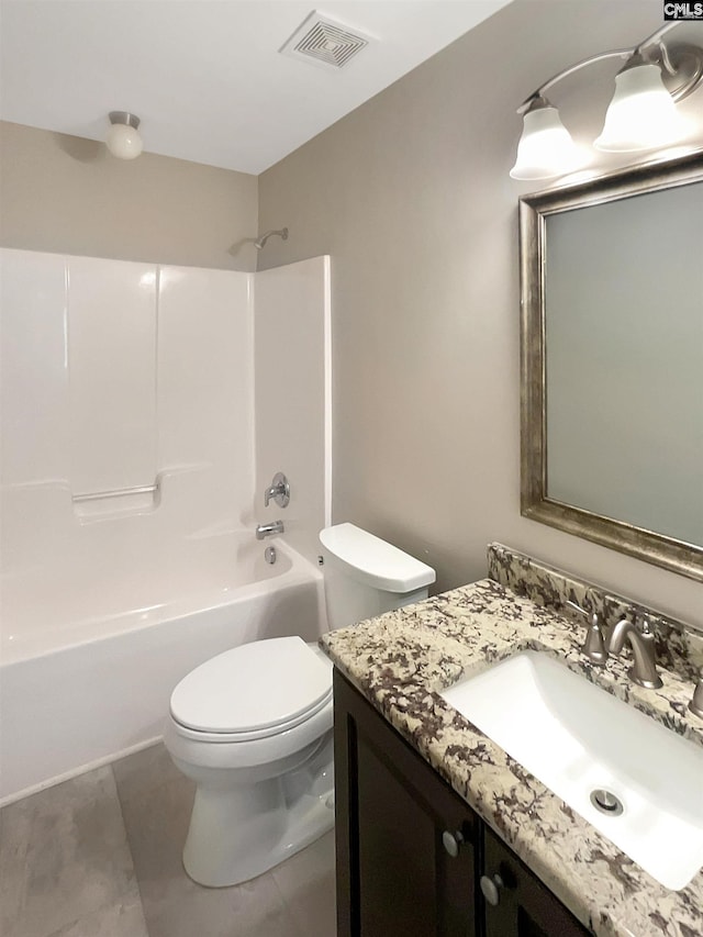 full bathroom featuring washtub / shower combination, vanity, and toilet