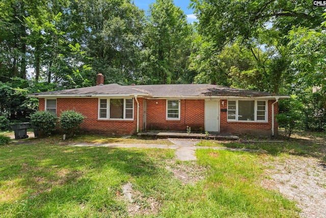 ranch-style home with a front yard