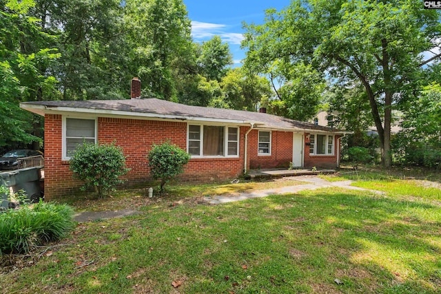 ranch-style house with a front yard