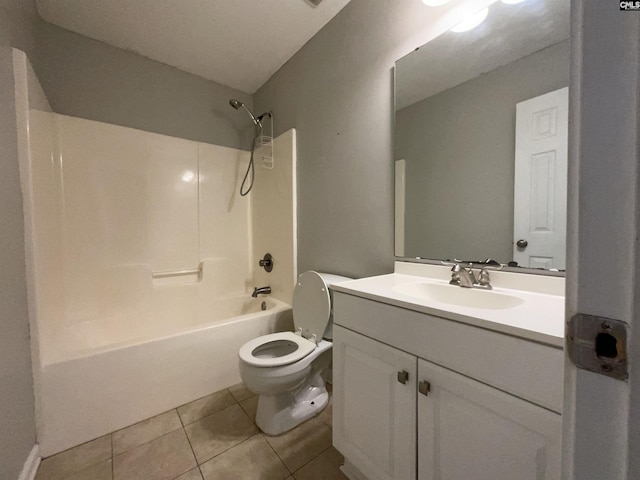 full bathroom with tile patterned flooring, vanity, washtub / shower combination, and toilet