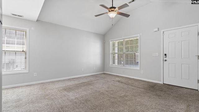 spare room with carpet, ceiling fan, and high vaulted ceiling