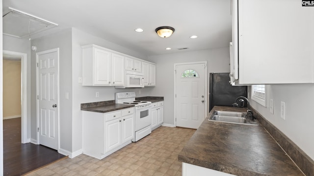 kitchen with white cabinetry, sink, a healthy amount of sunlight, and white appliances