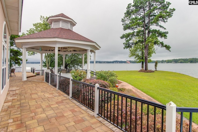 view of patio / terrace featuring a water view and a gazebo