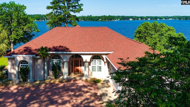 view of front of house featuring a water view