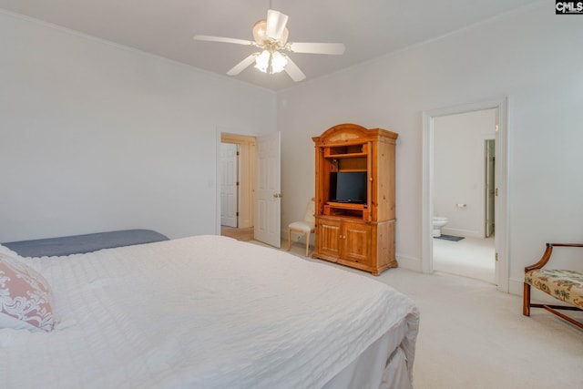 carpeted bedroom with connected bathroom and ceiling fan