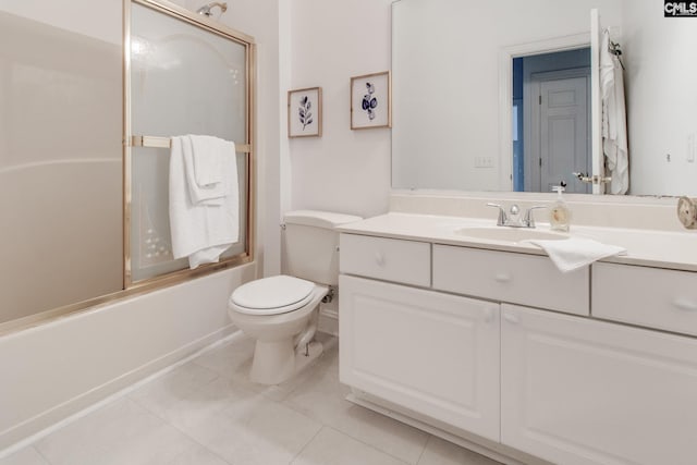 full bathroom featuring vanity, toilet, shower / bath combination with glass door, and tile patterned floors