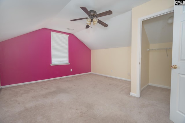 additional living space featuring lofted ceiling, carpet floors, and ceiling fan