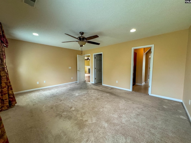 unfurnished bedroom with carpet flooring, a textured ceiling, and ceiling fan